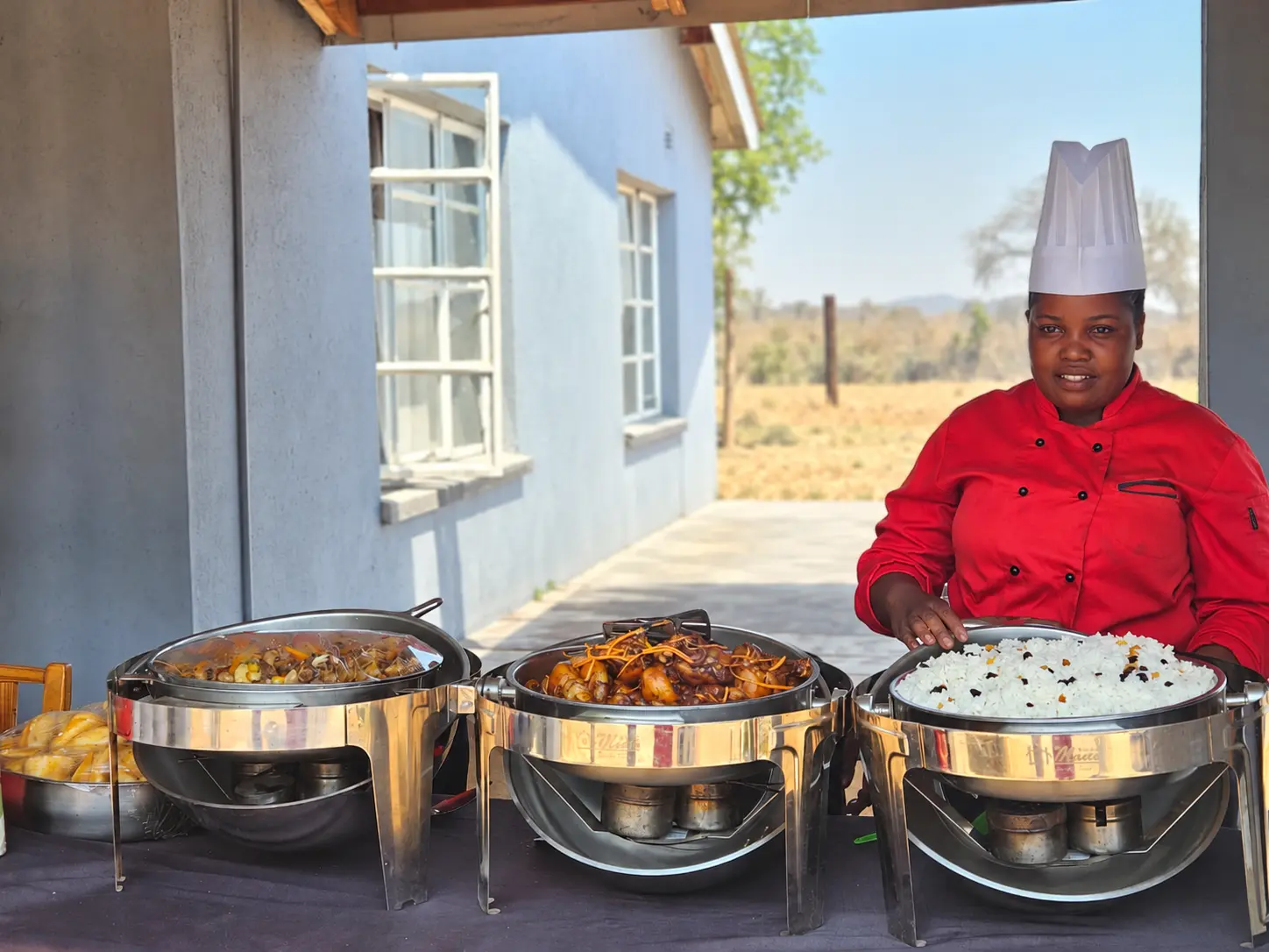 Classic Cuisine chef serving an outdoor buffet