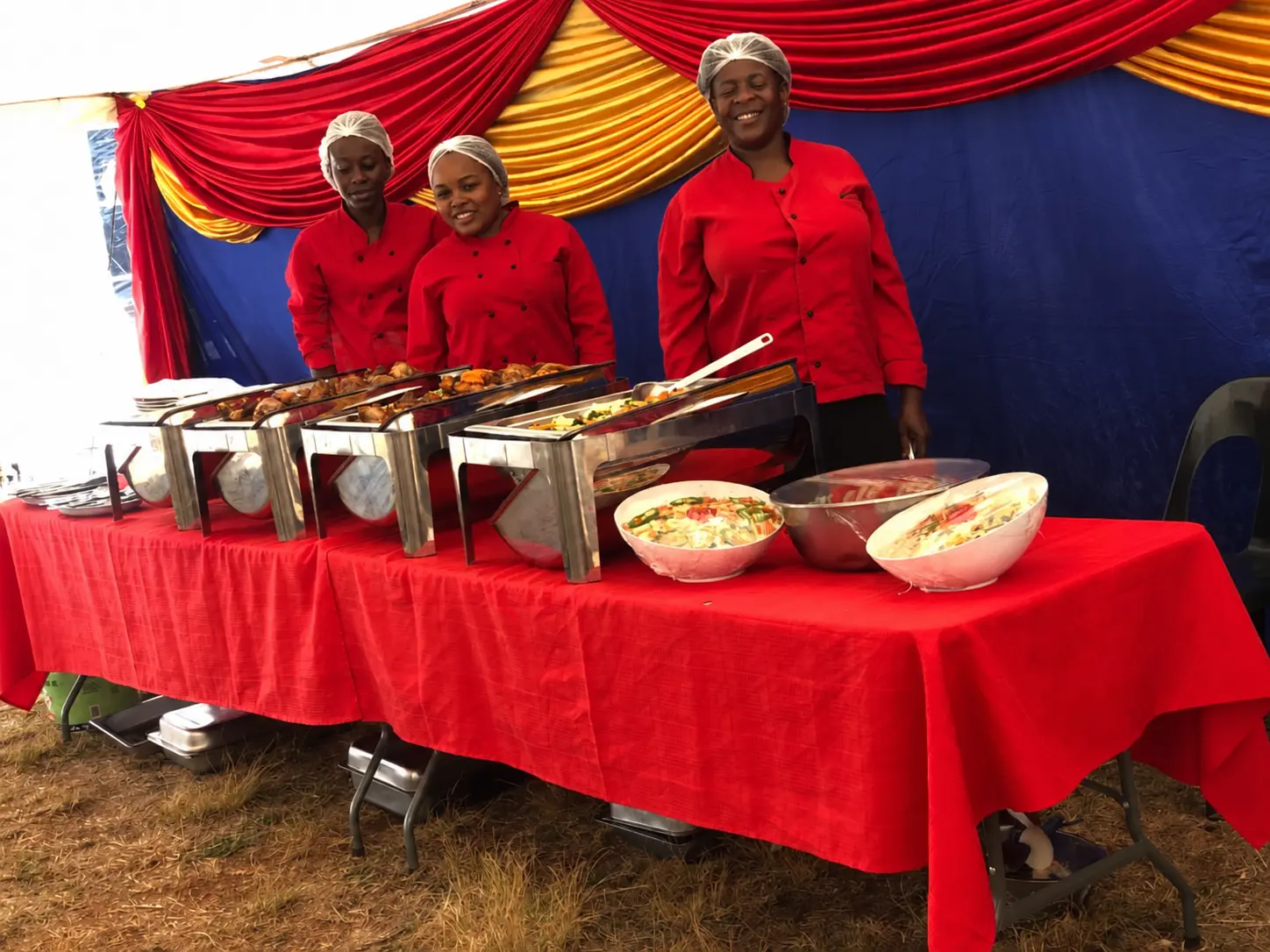 Classic Cuisine team serving an outdoor buffet